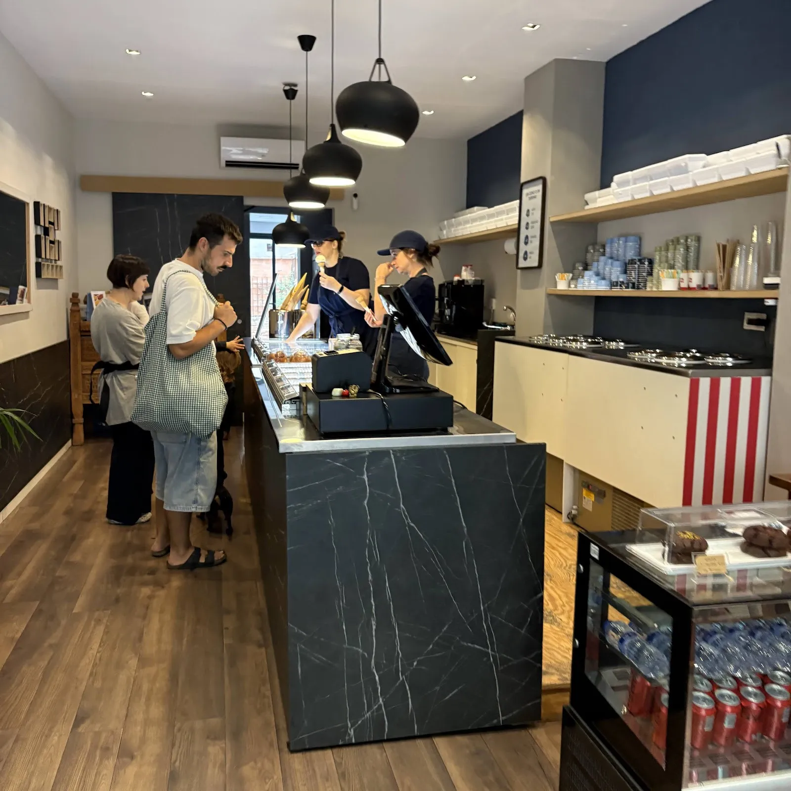 Customers at Cloud’s black marble counter